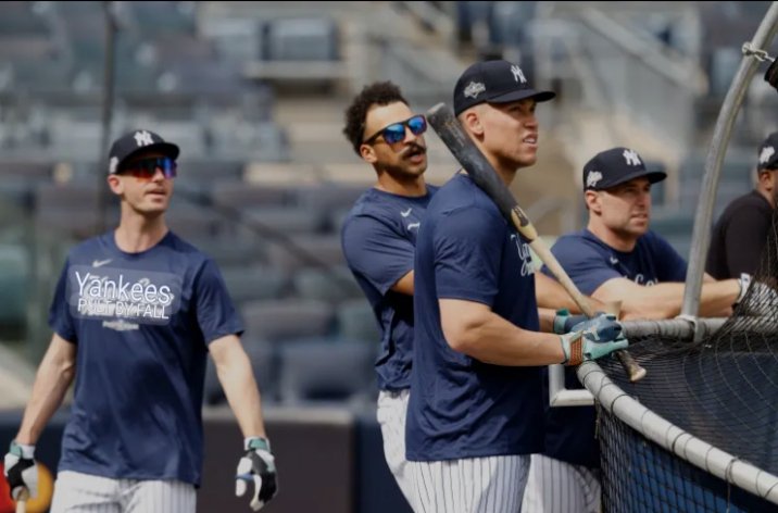 Yankees Players Gear Up for Action During Pre-Game Warm-Up Session